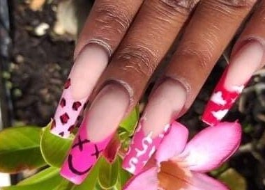 Vibrant nail art with pink and red designs at Cialeyah Beauty Bar, St Peter’s, Sint Maarten, SX.