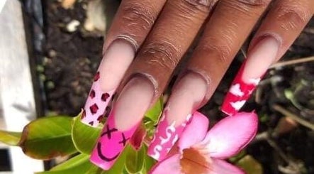 Vibrant nail art with pink and red designs at Cialeyah Beauty Bar, St Peter’s, Sint Maarten, SX.