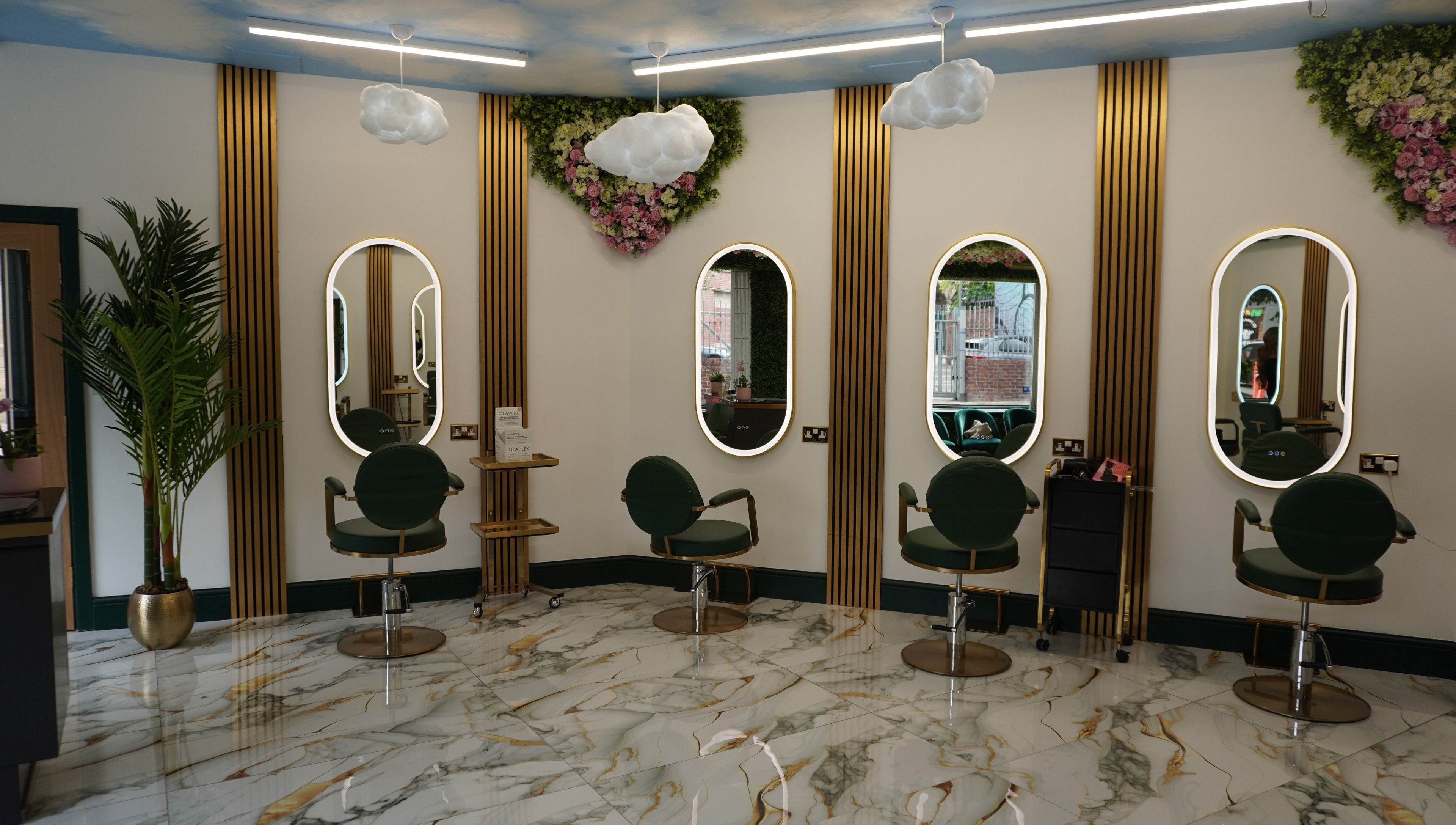 Chic interior of Headhunters Salon Leeds (Academy) with stylish seating, mirrors, and lush decor in Leeds, England, GB.