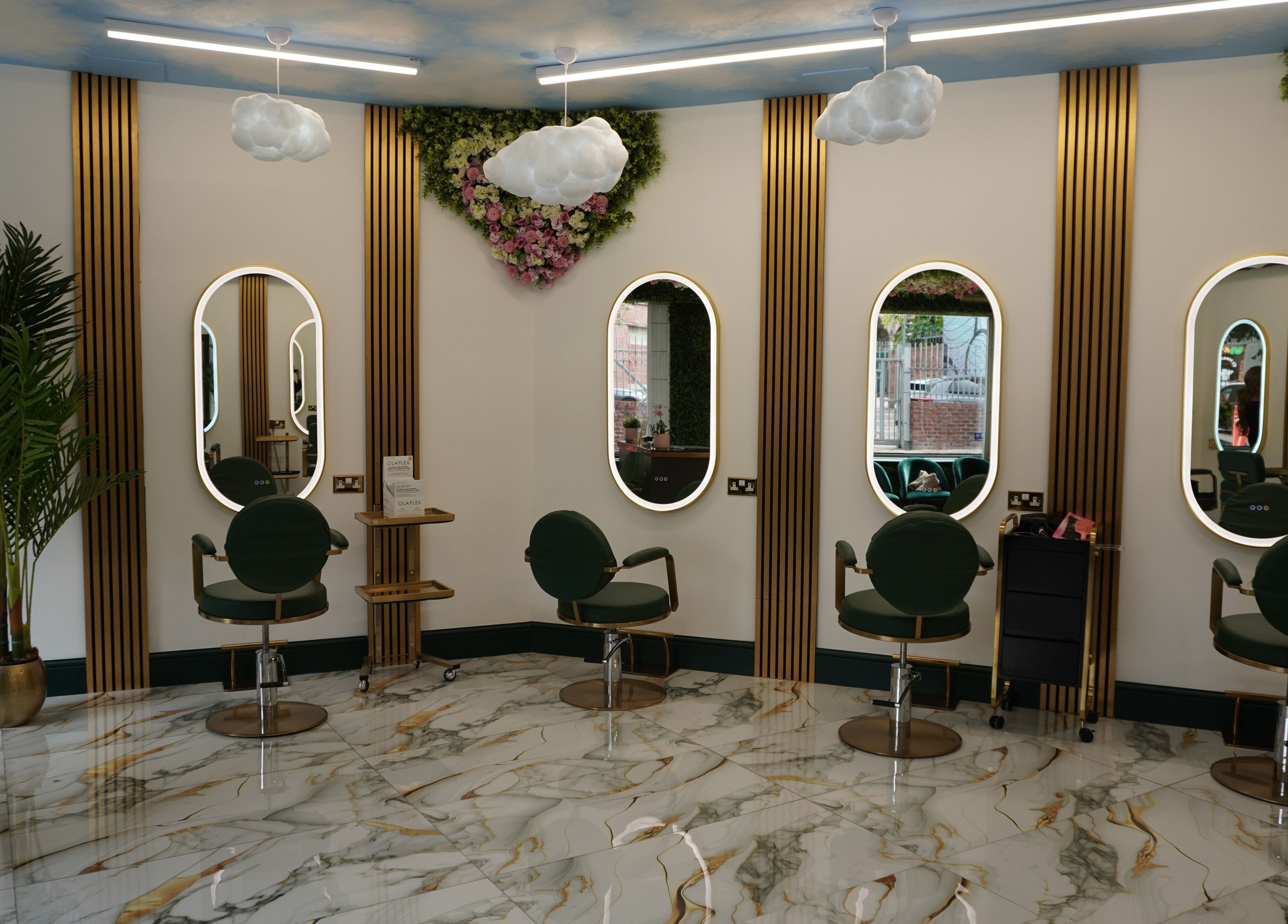 Chic interior of Headhunters Salon Leeds (Academy) with stylish seating, mirrors, and lush decor in Leeds, England, GB.