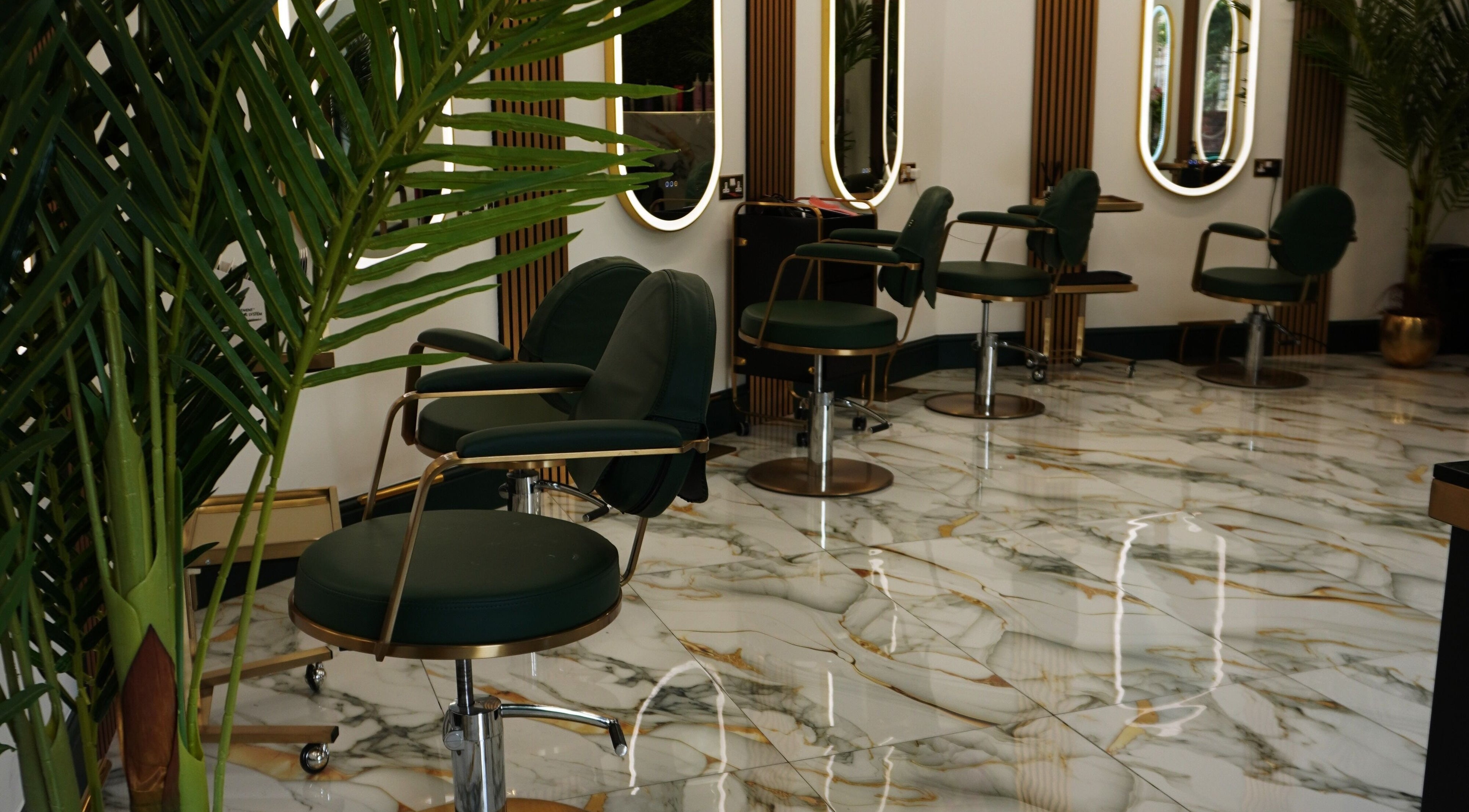 Stylish salon chairs at Headhunters Salon Leeds (Academy) in Leeds, England, GB with elegant decor.