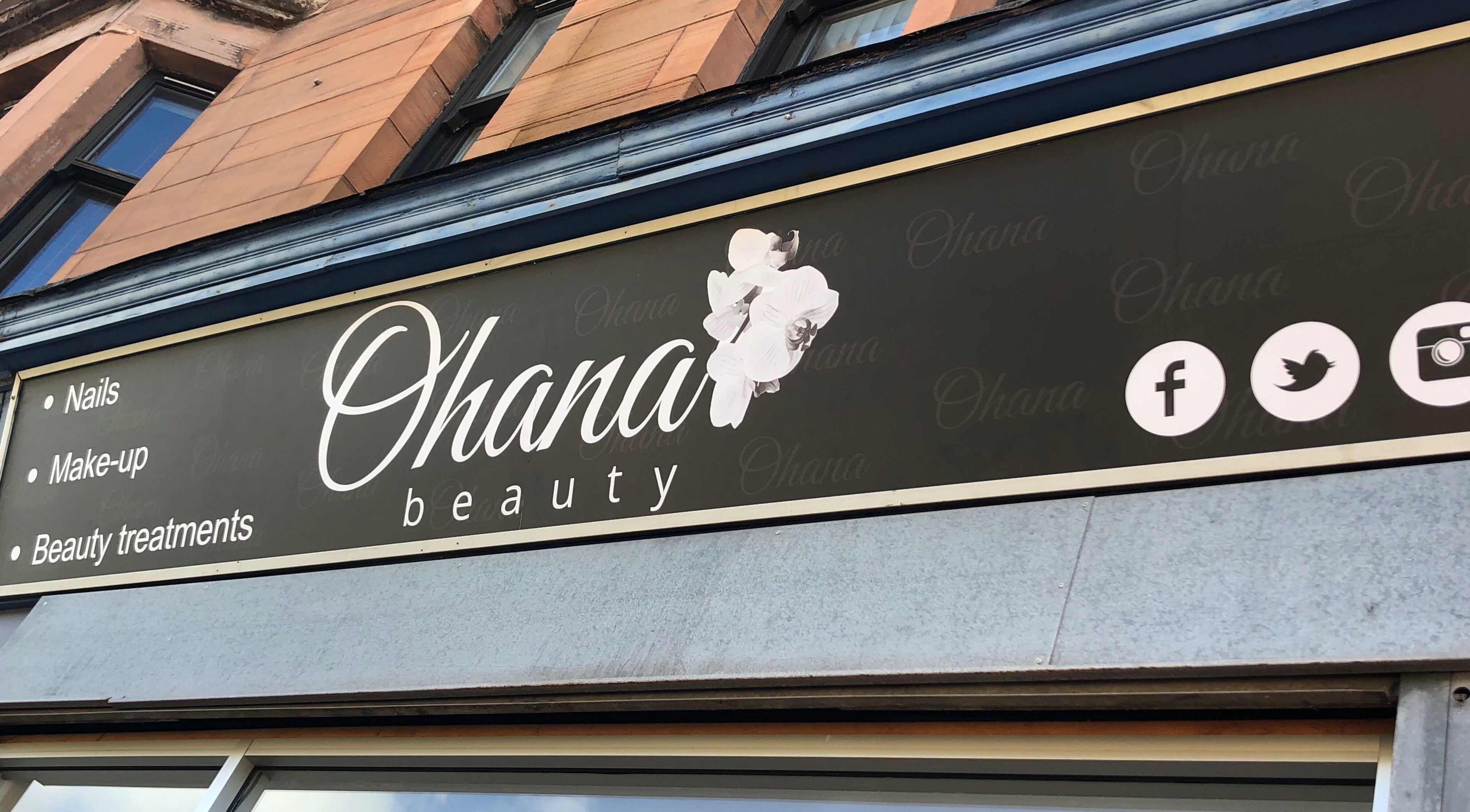 Ohana Beauty storefront sign in Rutherglen, Scotland, GB, highlighting nails and makeup services.