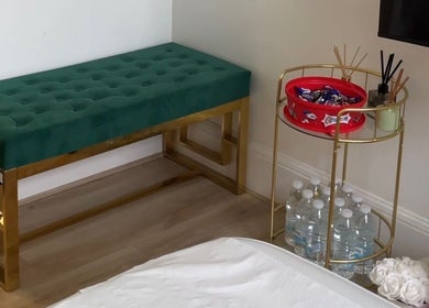 Elegant seating and refreshment area at Niz Beauty Base, London, England, GB, showcasing a stylish interior.