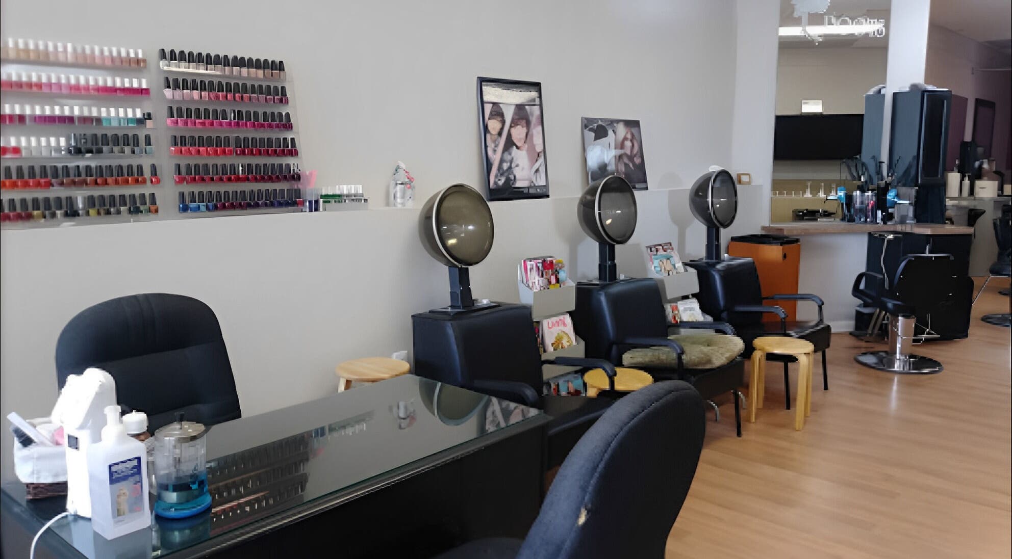 Modern salon interior at Roots Salon, Sterling Heights, Michigan, US showcasing nail polish and styling stations.