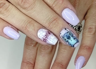 Stylish nail art at Lavi Beauty Clinic, Pretoria, Gauteng, ZA. Featuring pastel polish and cartoon design.