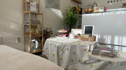 Cozy corner at Magiclash Brea in Brea, California, US with table and shelf for beauty and wellness ambiance.