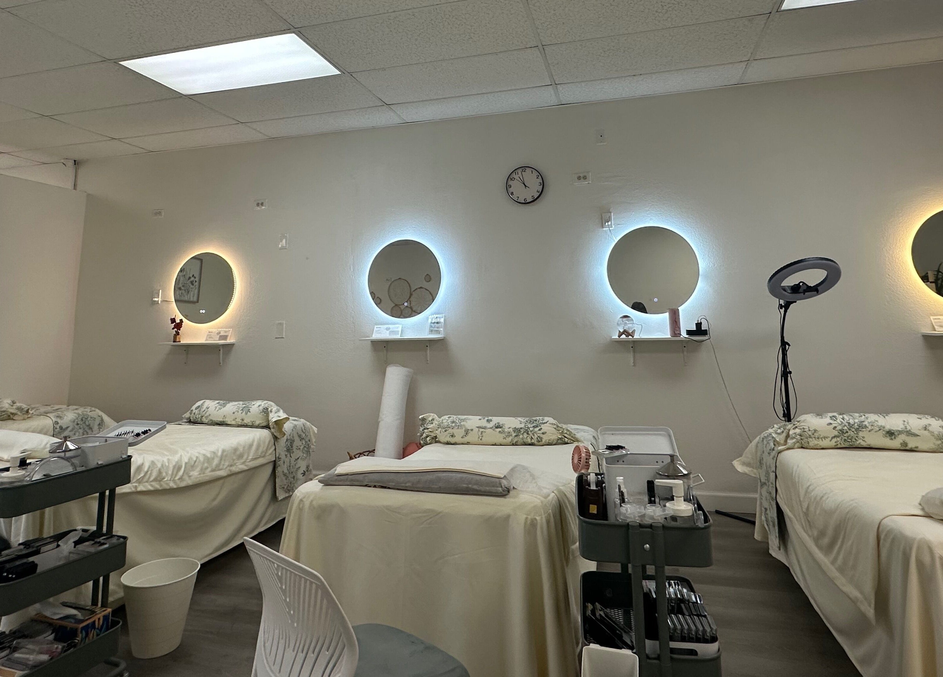 Elegant treatment room at Magiclash Brea, Brea, California, US, featuring comfy beds and soft lighting.