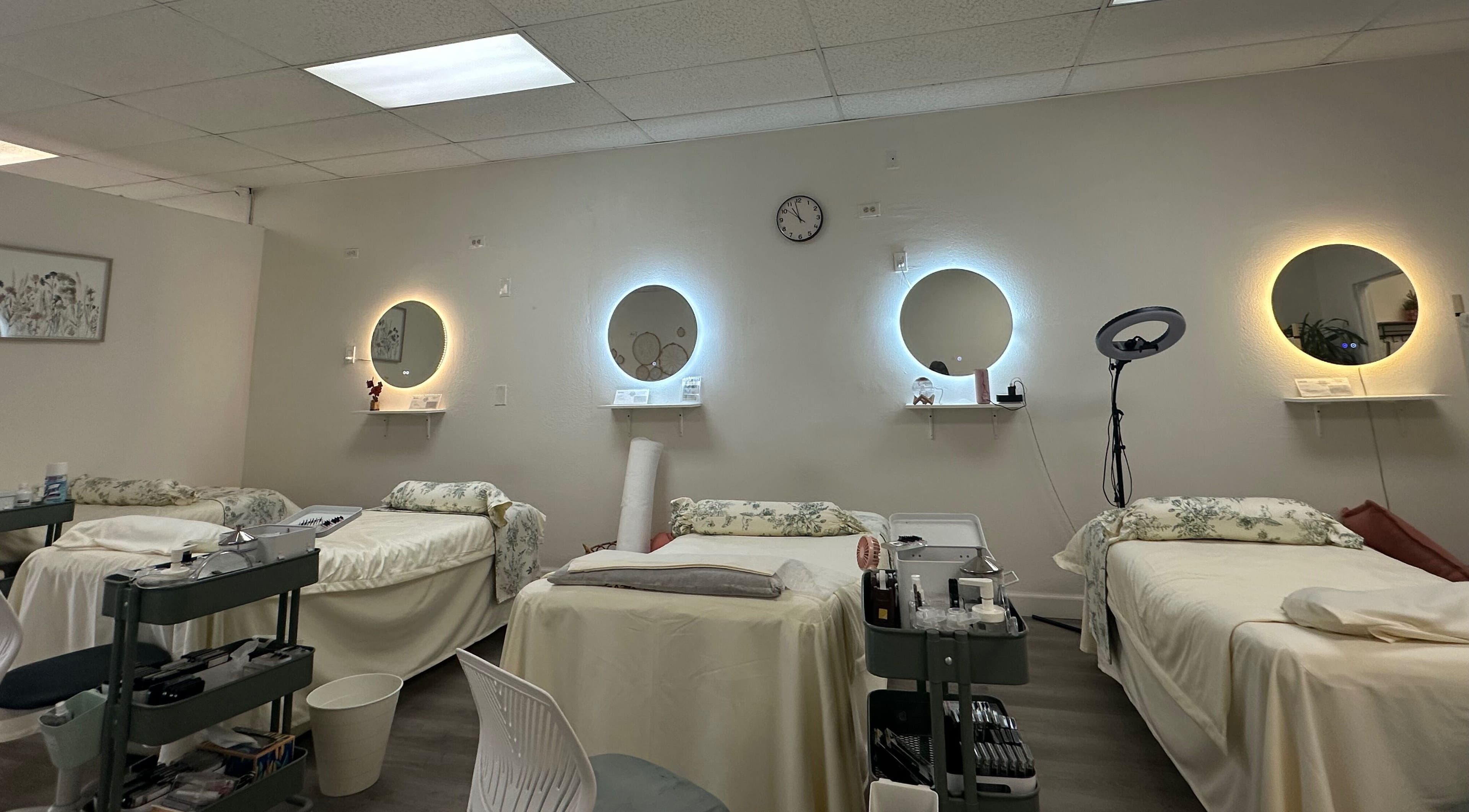 Elegant treatment room at Magiclash Brea, Brea, California, US, featuring comfy beds and soft lighting.