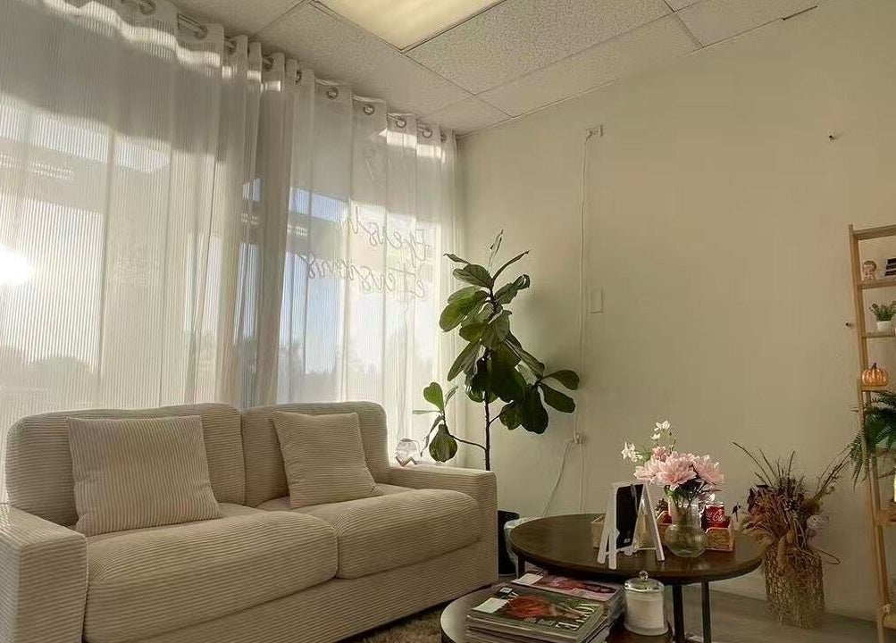 Cozy sitting area in Magiclash Brea, Brea, California, US with soft lighting and calming decor.