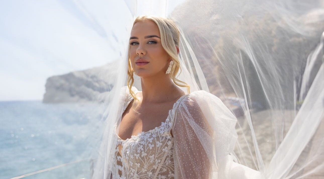 Bride in lace dress by the sea at Makeup & Beauty by Shôna, Tonypandy, Wales, GB.