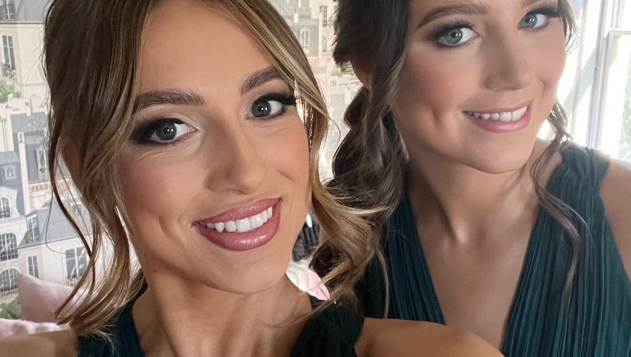 Two smiling women at The Tan Studio in Middlesbrough, England, GB showcasing flawless makeup.