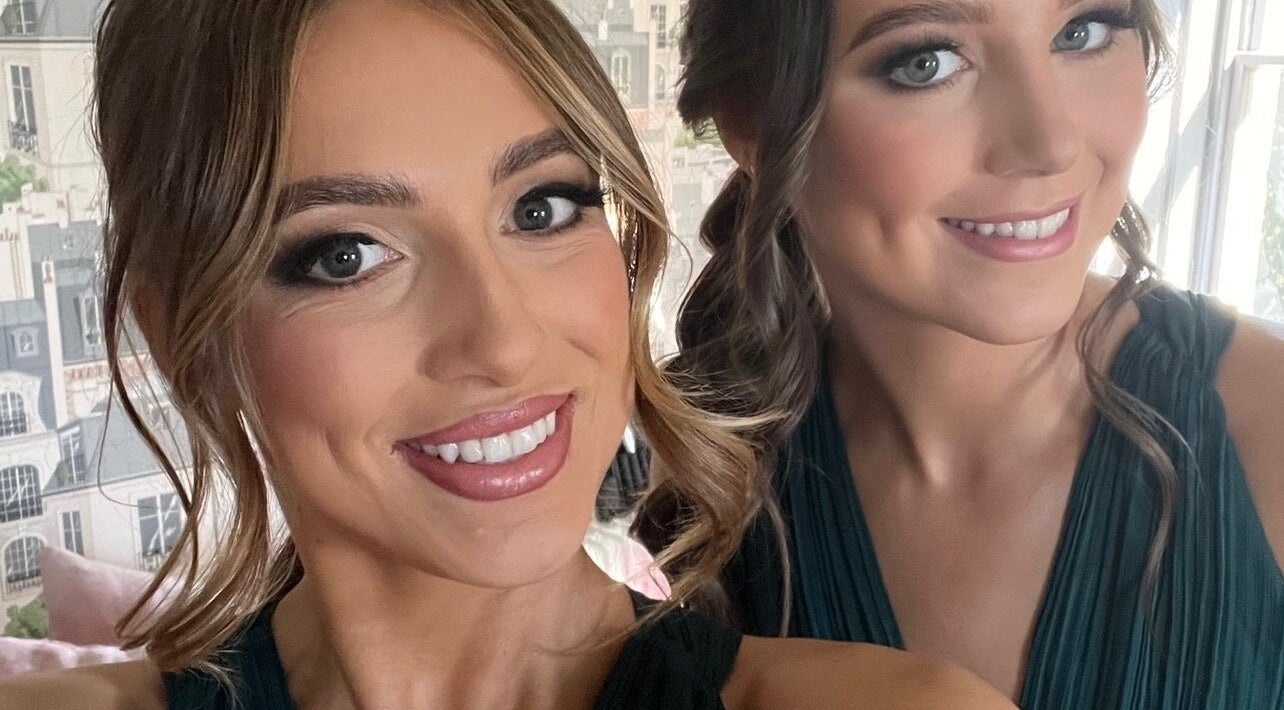 Two smiling women at The Tan Studio in Middlesbrough, England, GB showcasing flawless makeup.