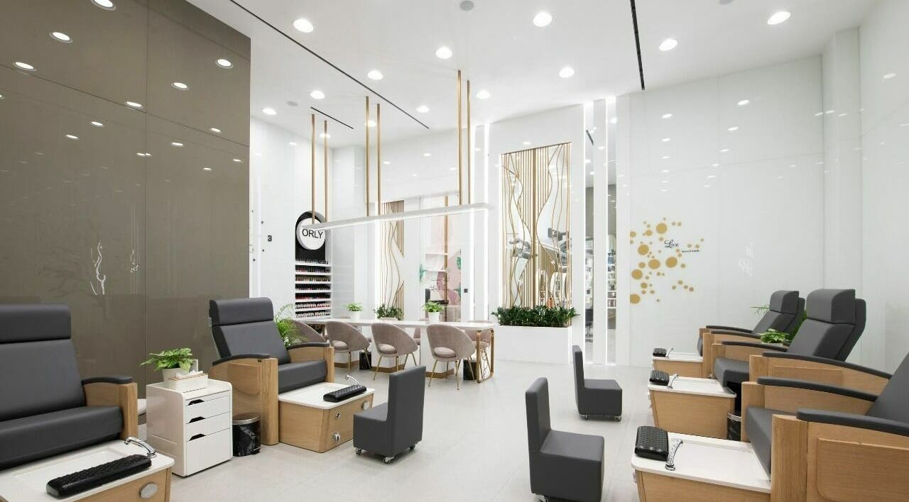 Modern nail salon at WOW Beauty Salon - Dubai Mall, featuring elegant seating in Dubai, AE.