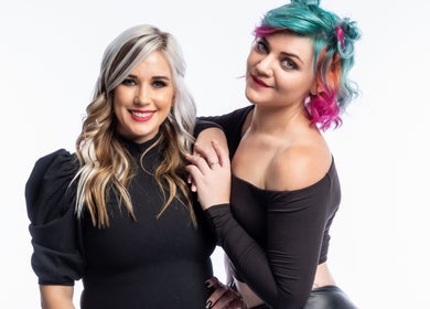 Two women with stylish hair at The Hair Scene, Pretoria, Gauteng, ZA, showcasing vibrant styles.