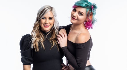 Two women with stylish hair at The Hair Scene, Pretoria, Gauteng, ZA, showcasing vibrant styles.