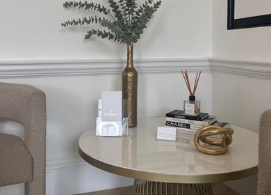 Elegant lounge area at Brow Babes - BrowZ by Harry, Truro, England, GB with gold accents and decor.