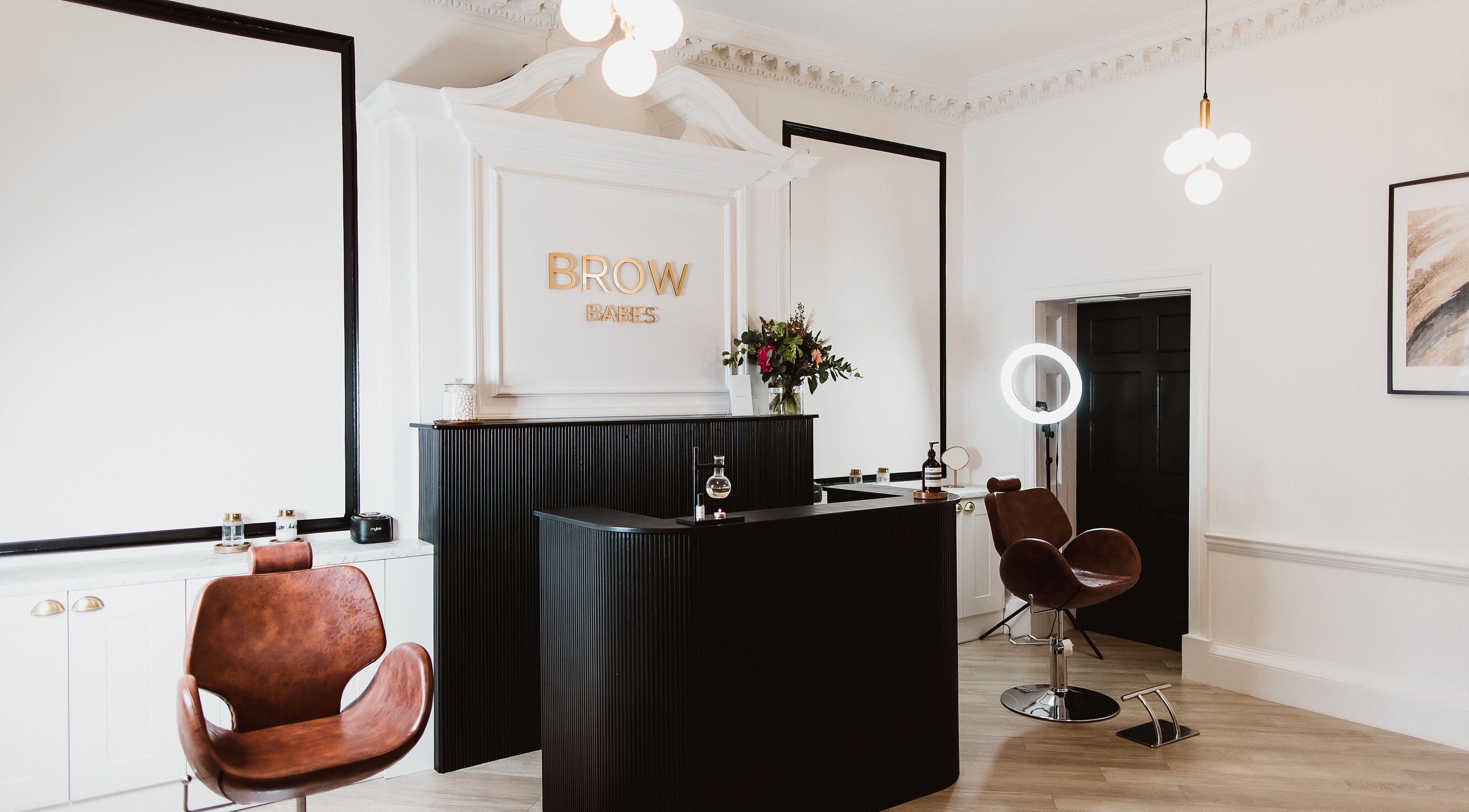 Interior of Brow Babes - Harry in Truro, England, GB, featuring elegant seating and modern decor.