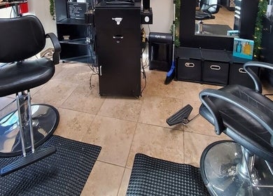 Modern styling chairs at Hair Unlimited Salon in Jacksonville, Florida, US showcasing a sleek and welcoming salon interior.