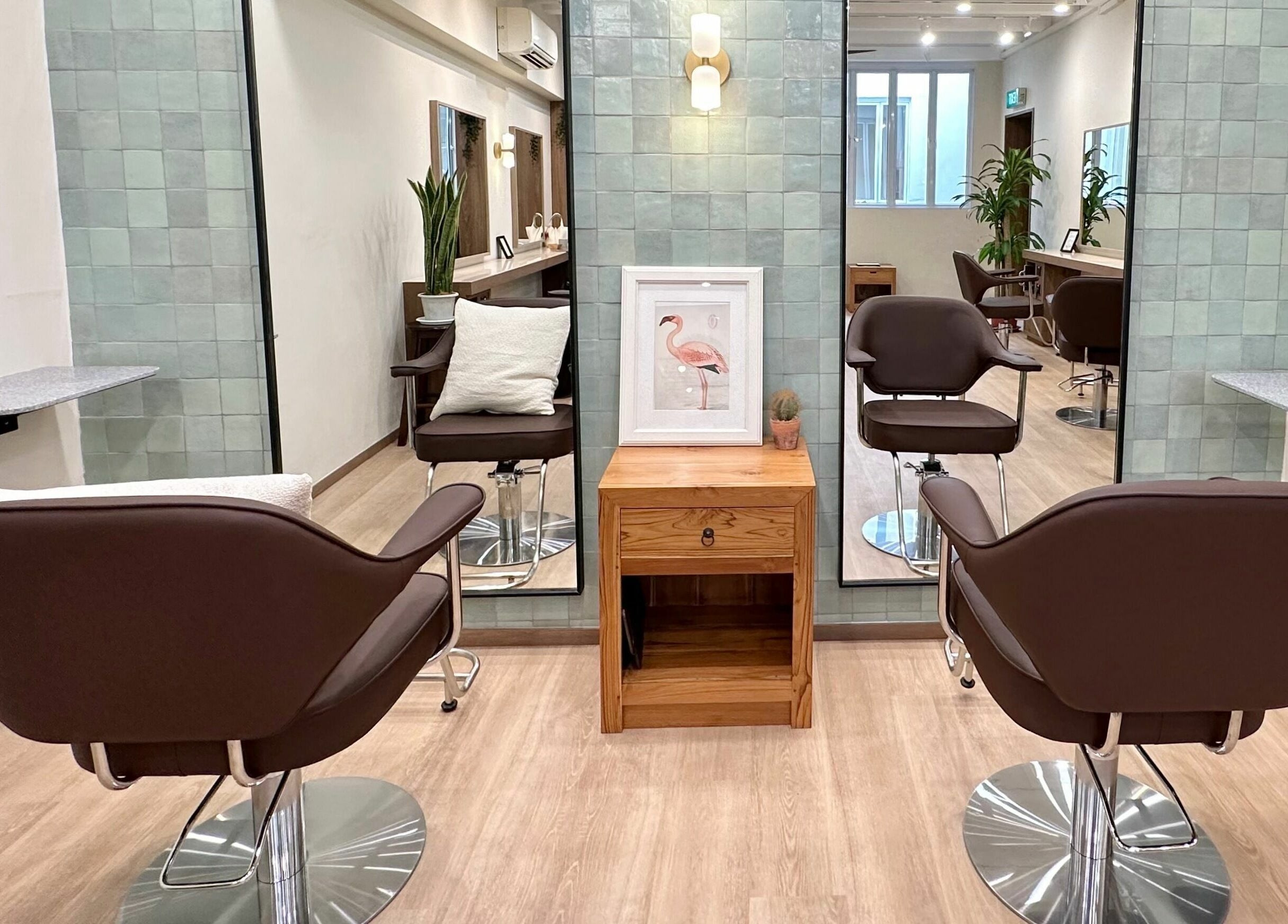 Chic salon interior of Hairstudio Flamingo - Tanjong Pagar, Singapore, SG with modern chairs and elegant decor.