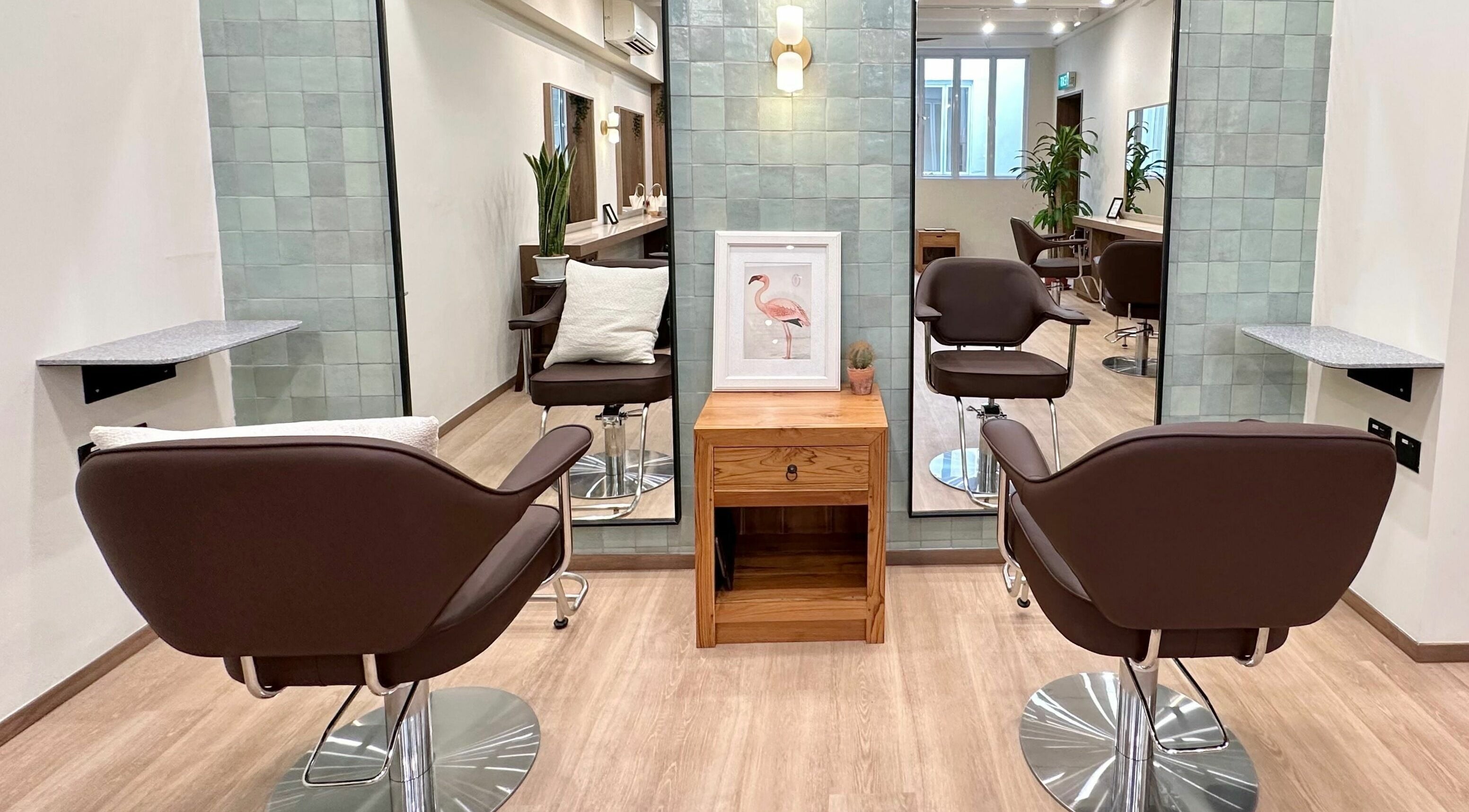 Chic salon interior of Hairstudio Flamingo - Tanjong Pagar, Singapore, SG with modern chairs and elegant decor.