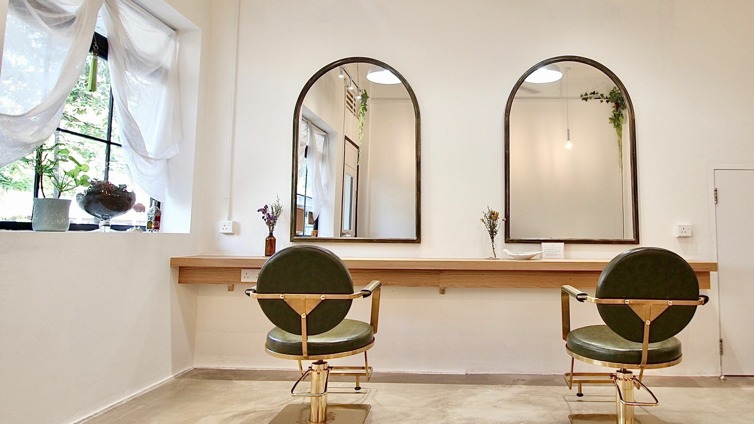 Hairstudio Flamingo - Tiong Bahru's elegant salon setup in Singapore, Singapore, SG with stylish mirrors and chairs.