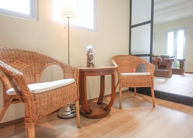 Comfortable waiting area with wicker chairs at Eyelash Studio Flamingo - Tanjong Pagar, Singapore, Singapore, SG.