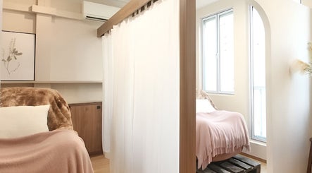 Cozy interior at Eyelash Studio Flamingo - Tanjong Pagar, Singapore, Singapore, SG with soft lighting and plush seating.