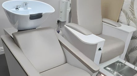 Luxurious beauty chairs at Nouveaux Hair and Beauty, Plymouth, England, GB, offering comfort and style.