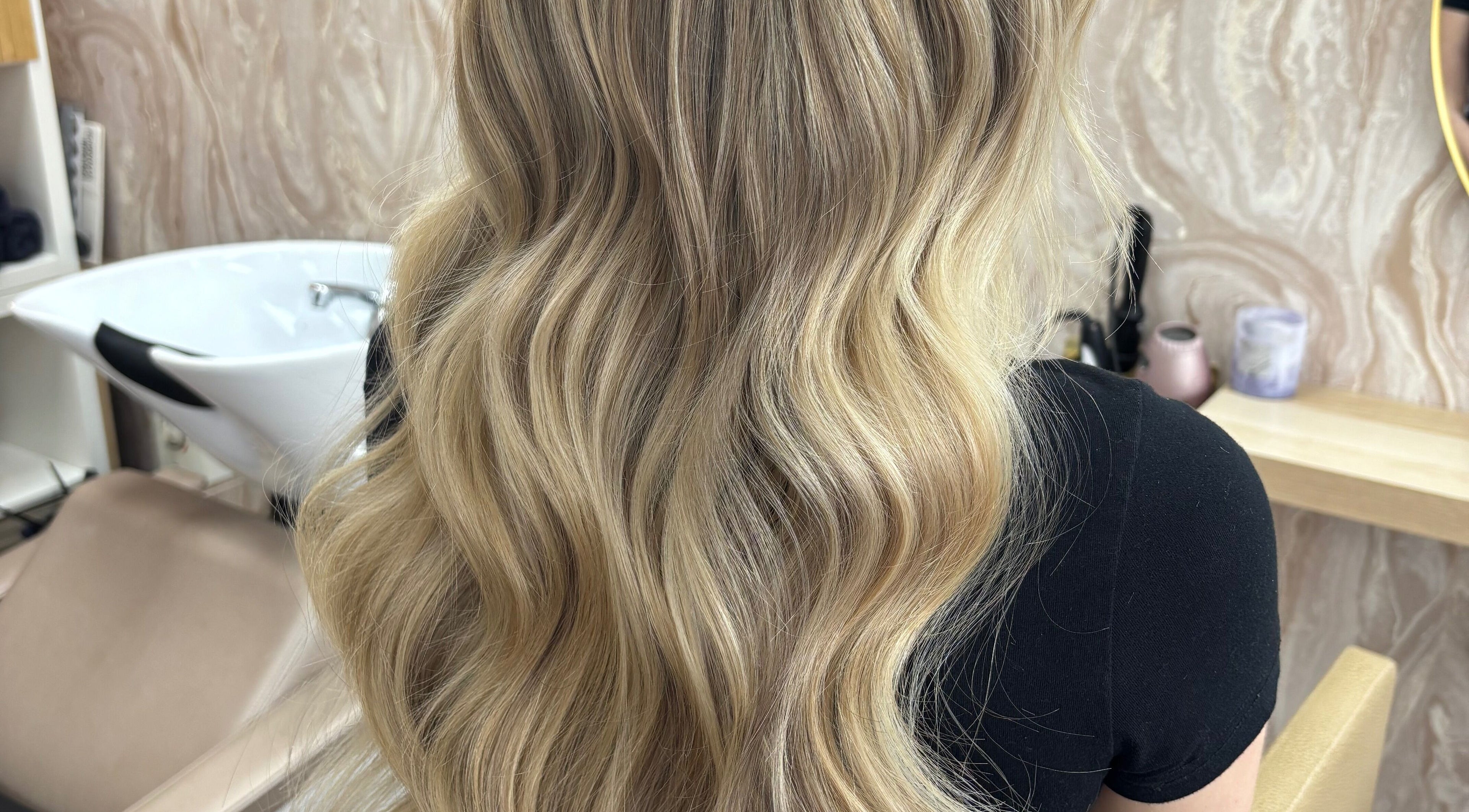 Flowing blonde waves styled at Nouveaux Hair and Beauty, Plymouth, England, GB, showcasing elegant hair artistry.