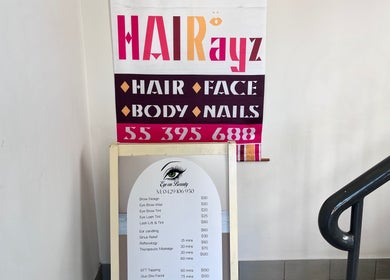 Eye on Beauty services and pricing board at Bundall, Queensland, AU entrance.
