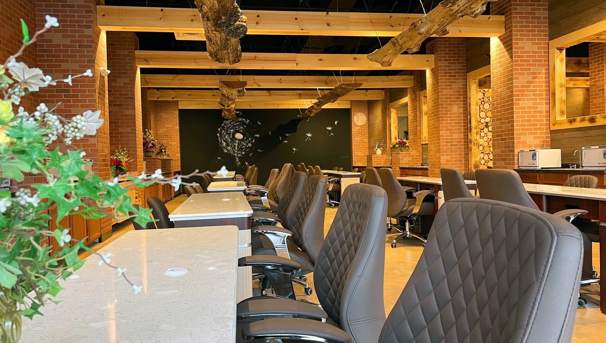 Modern manicure stations at Racine Nails, Racine, Wisconsin, US, showcasing stylish decor and comfortable seating.