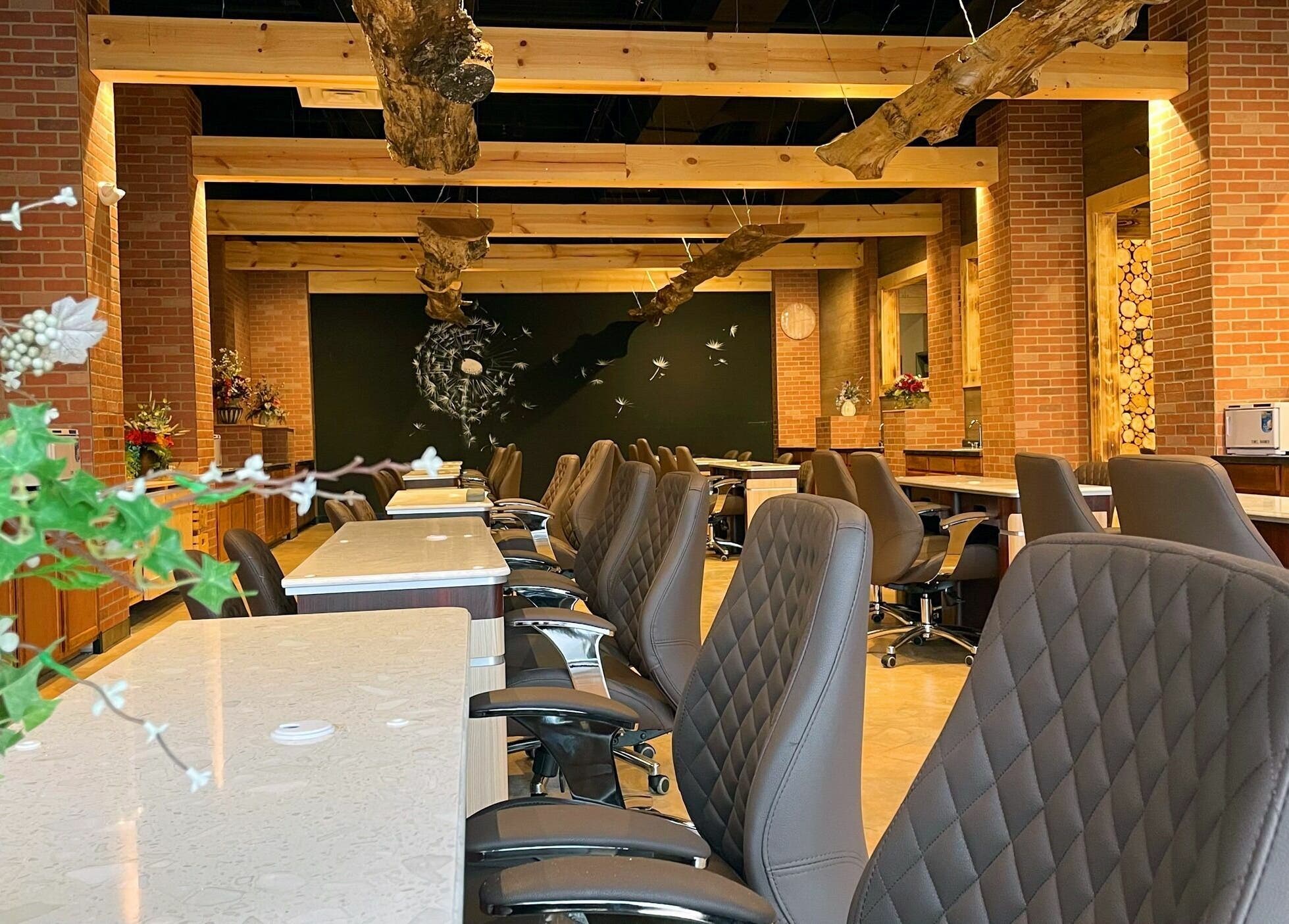 Modern manicure stations at Racine Nails, Racine, Wisconsin, US, showcasing stylish decor and comfortable seating.