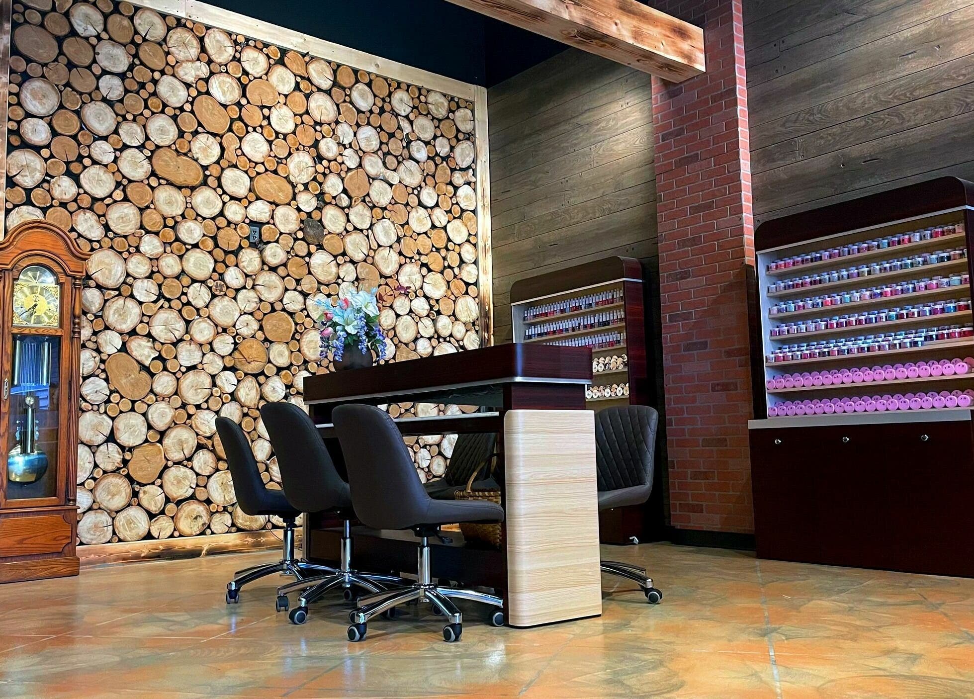 Racine Nails venue in Racine, Wisconsin, US featuring rustic decor with wood accents and a nail polish display.