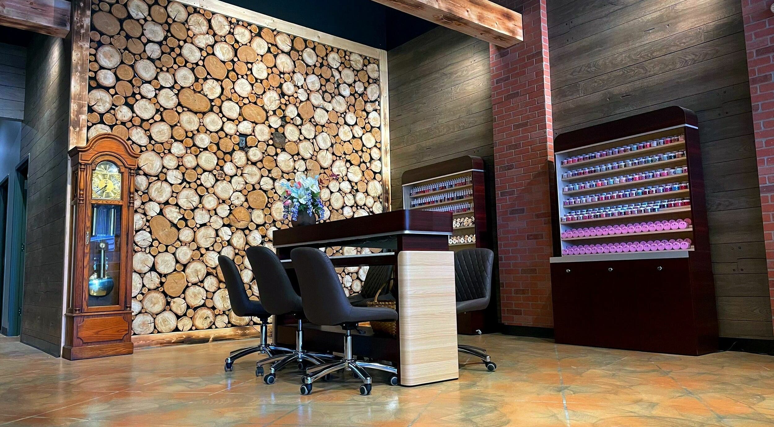 Racine Nails venue in Racine, Wisconsin, US featuring rustic decor with wood accents and a nail polish display.