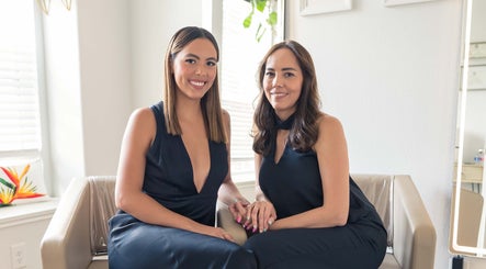 Team Lilian Sanchez professionals at beauty venue in Katy, Texas, US, seated and smiling warmly.