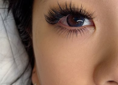 Close-up of eyelash extensions at 9AMLash, Vaughan, Ontario, CA, showcasing stunning beauty results.