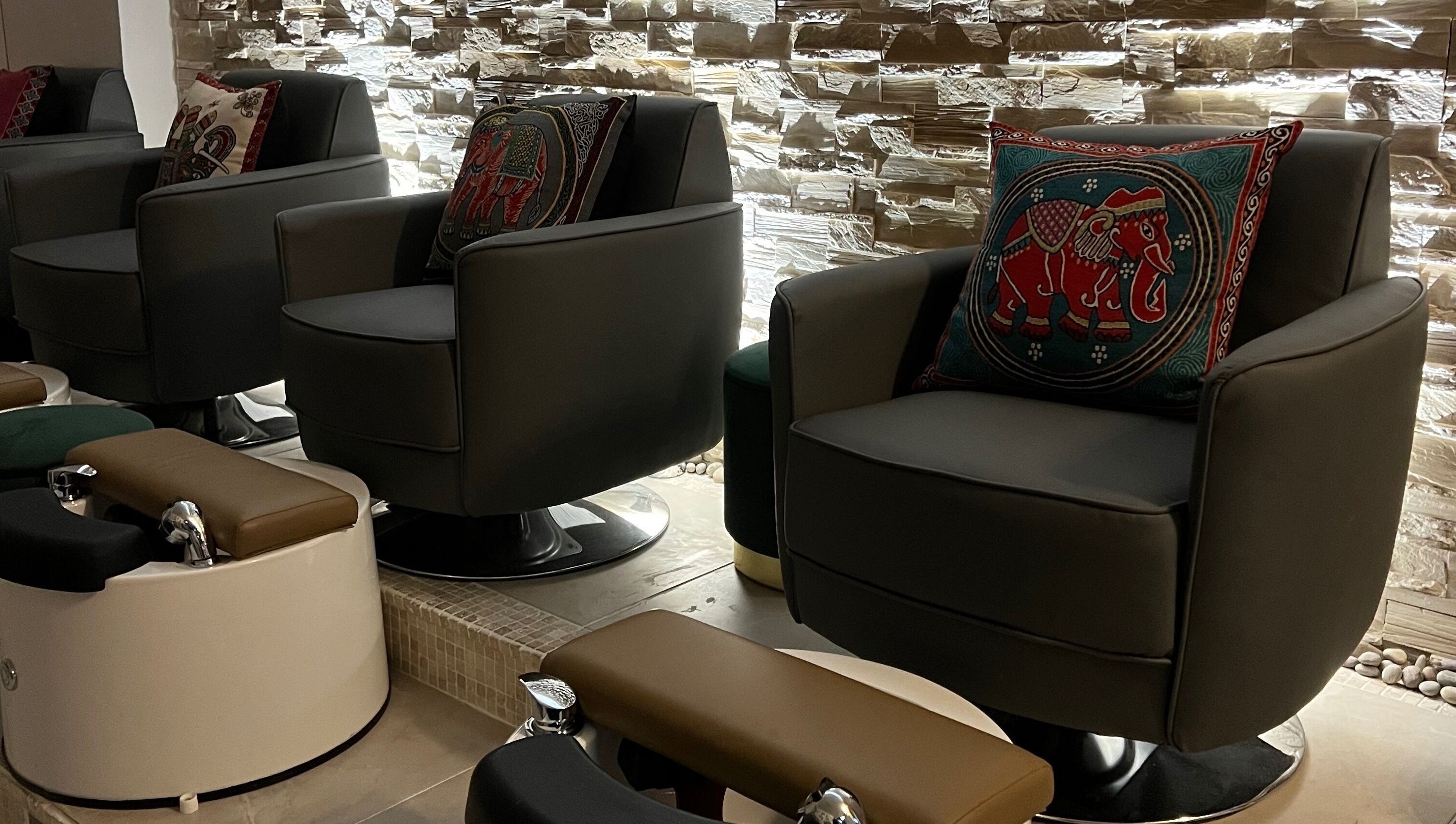 Luxurious pedicure chairs at Rose Nails in Barking, England, GB create a tranquil and stylish atmosphere.