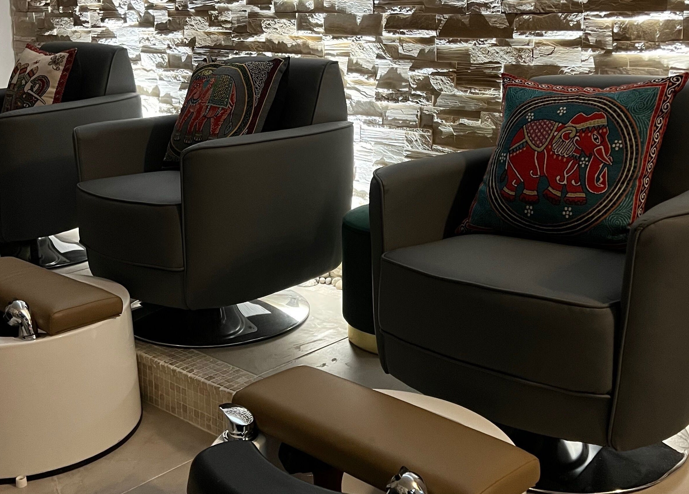 Luxurious pedicure chairs at Rose Nails in Barking, England, GB create a tranquil and stylish atmosphere.