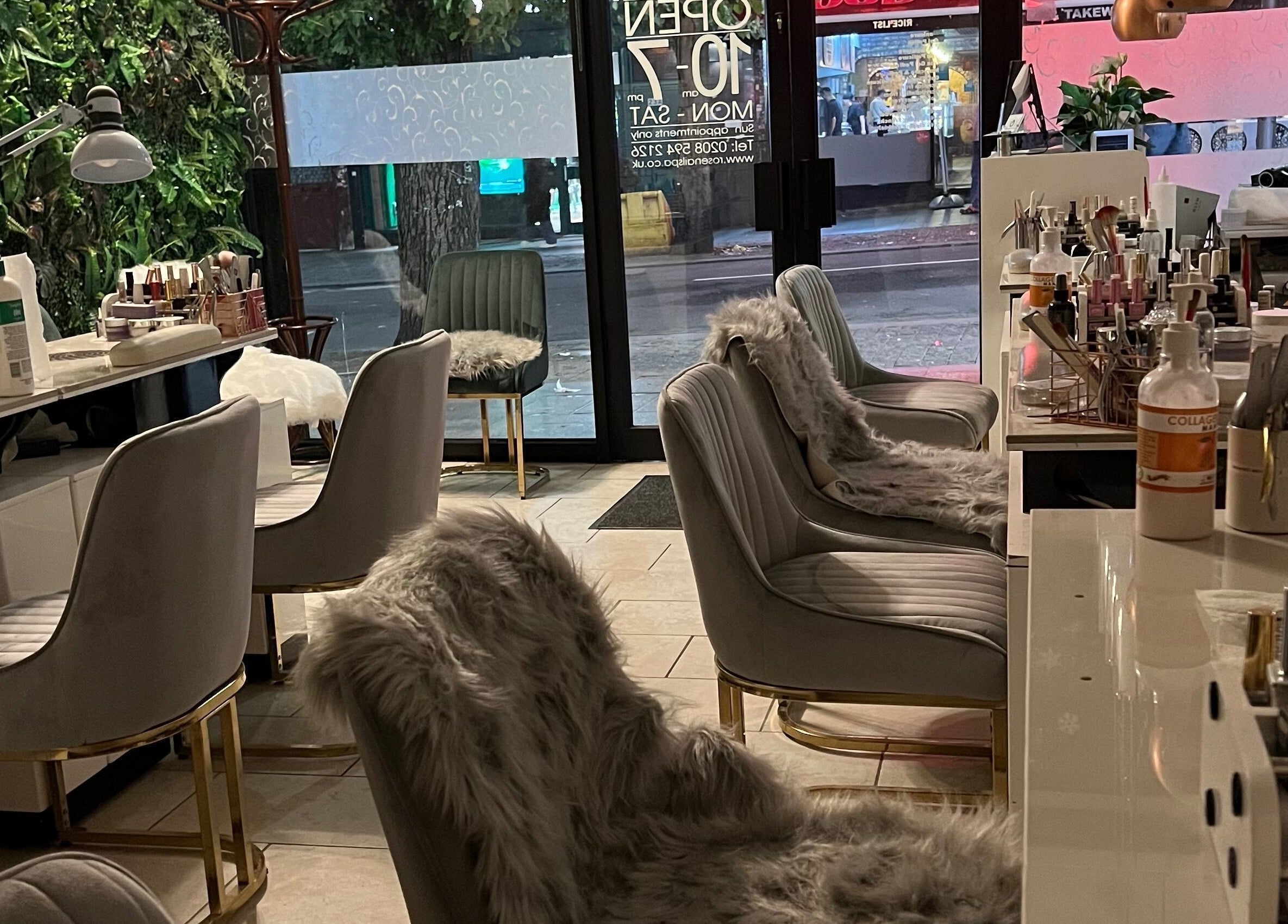 Stylish interior of Rose Nails, Barking, England, GB with plush chairs and manicure stations.