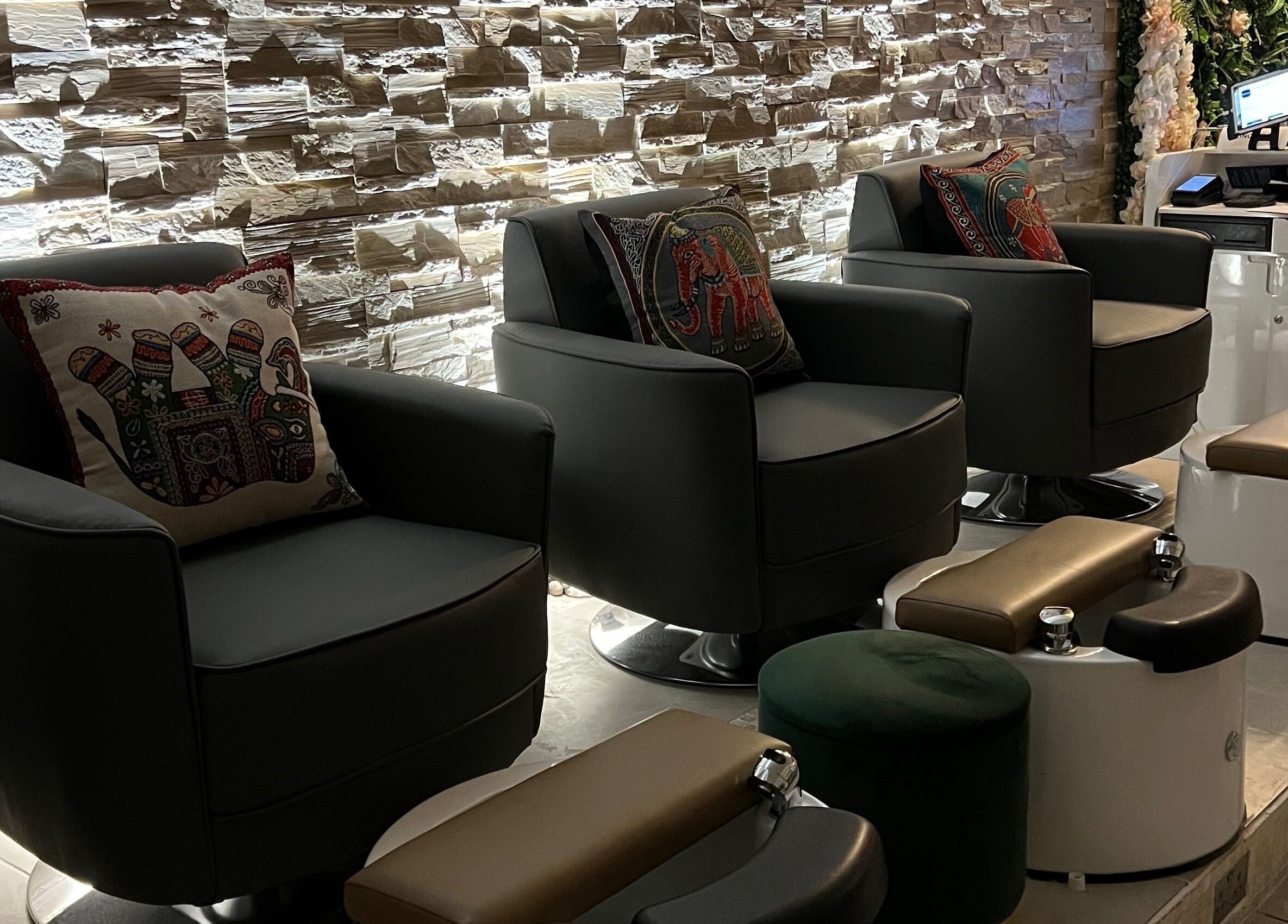 Luxurious pedicure seating at Rose Nails, Barking, England, GB, featuring elegant decor and plush cushions.