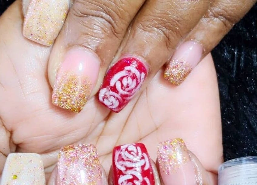 Glittery nail art with floral designs at Passion Touches Spa in Bridgetown, Saint Michael, BB.