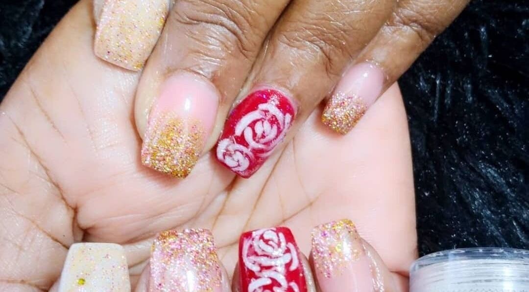 Glittery nail art with floral designs at Passion Touches Spa in Bridgetown, Saint Michael, BB.