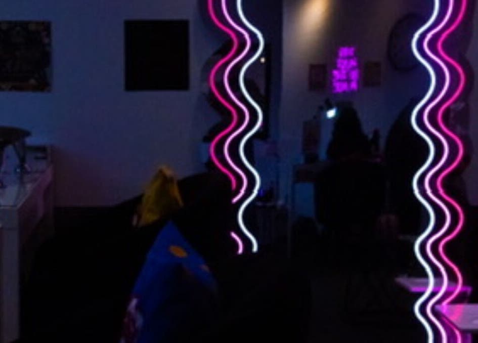 Stylish neon-lit interior of Gee’s Beauty Gloucester, creating a modern vibe in Gloucester, England, GB.
