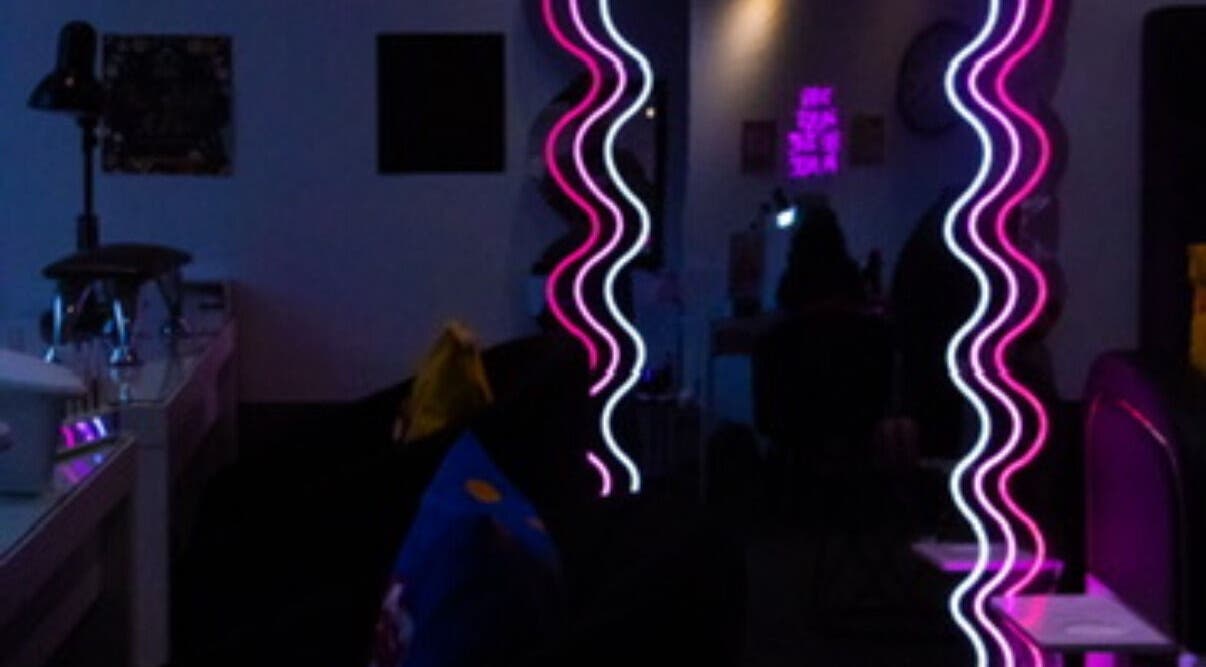 Stylish neon-lit interior of Gee’s Beauty Gloucester, creating a modern vibe in Gloucester, England, GB.