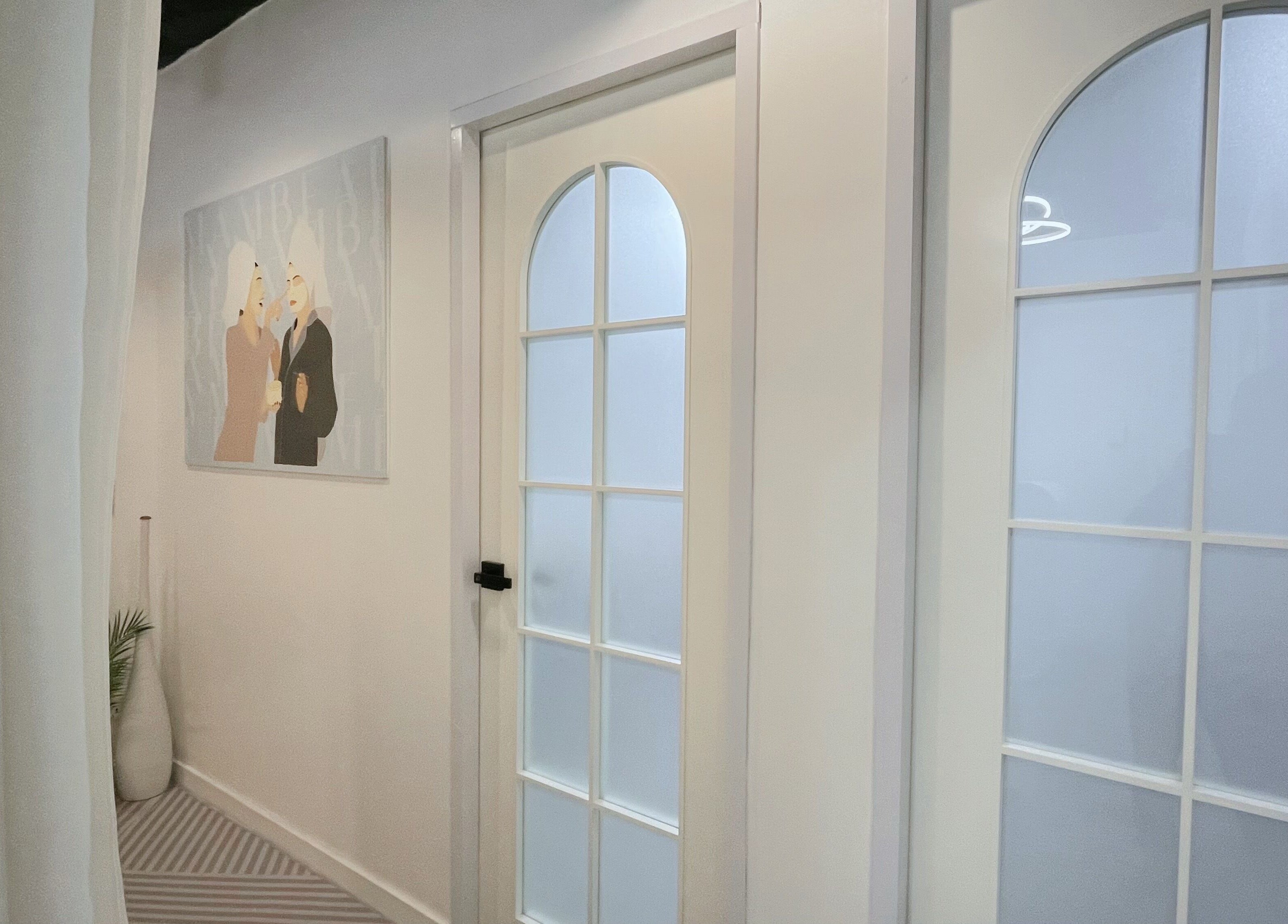 Chic interior hallway with frosted glass doors at MAM Beauty, 旺角, HK.