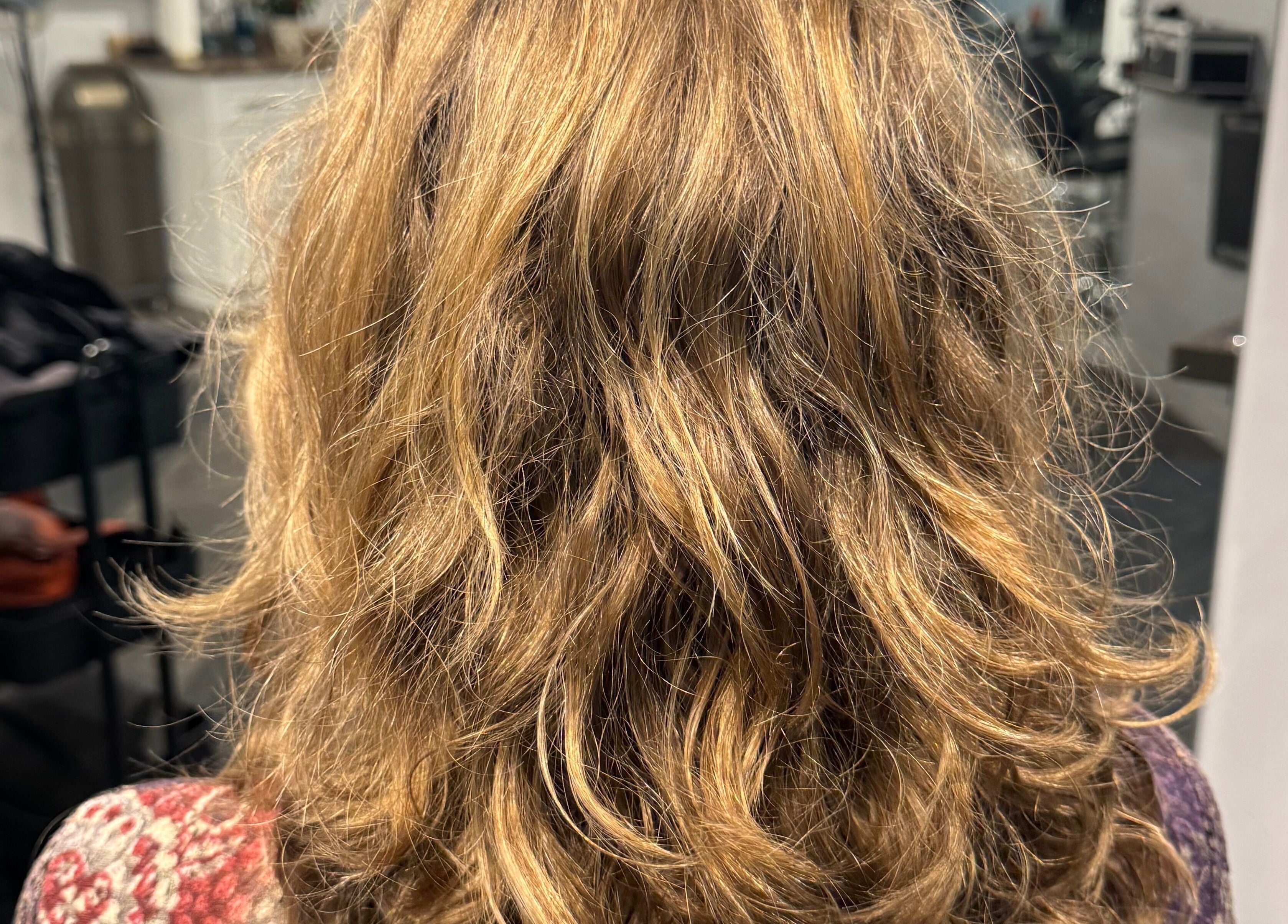 Blonde wavy hairstyle at Creative Look, 83 Sherbrook Street, Winnipeg, Manitoba, CA salon.