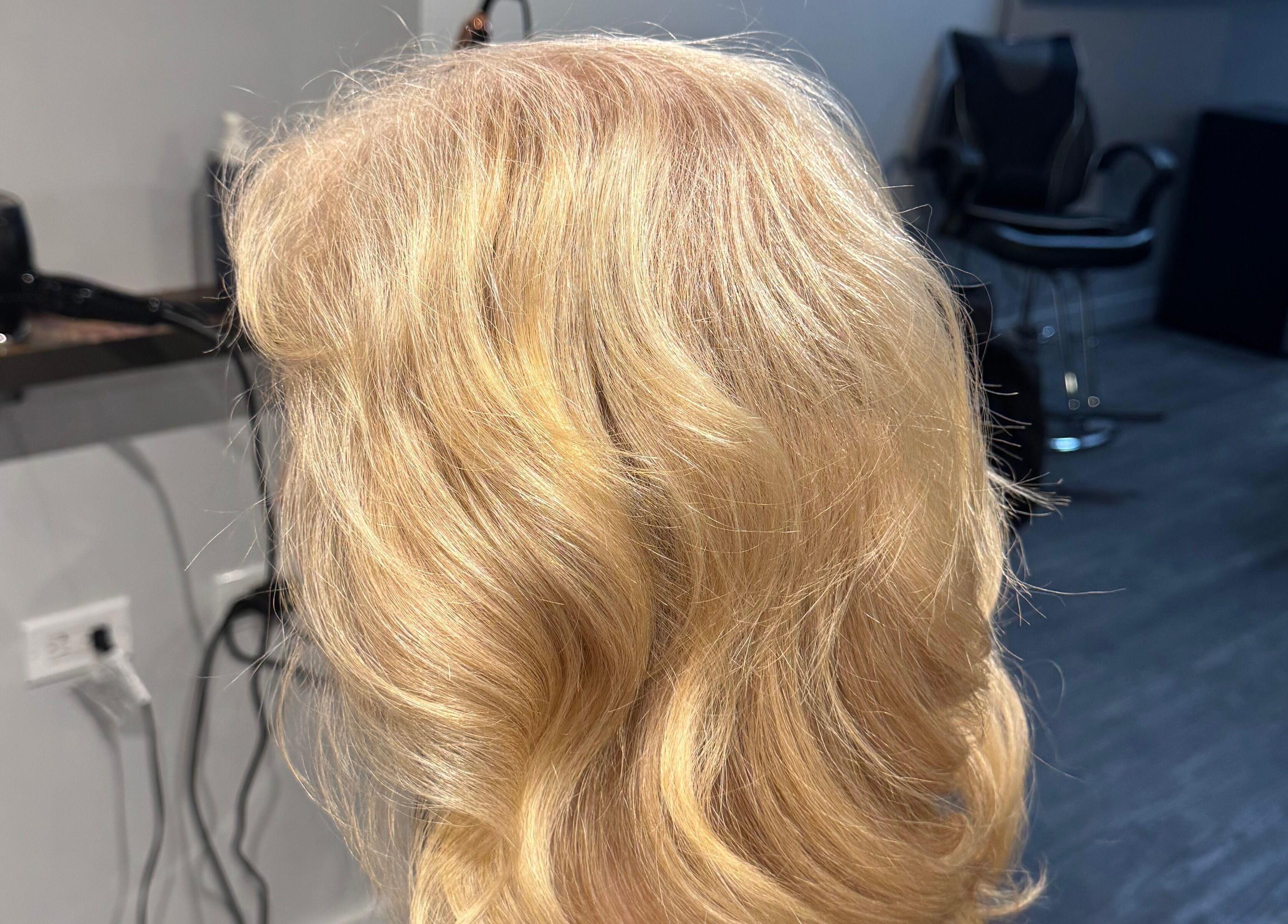 Golden blonde hair styled in soft waves at Creative Look, Ruwis 83 Sherbrook Street, Winnipeg, Manitoba, CA.