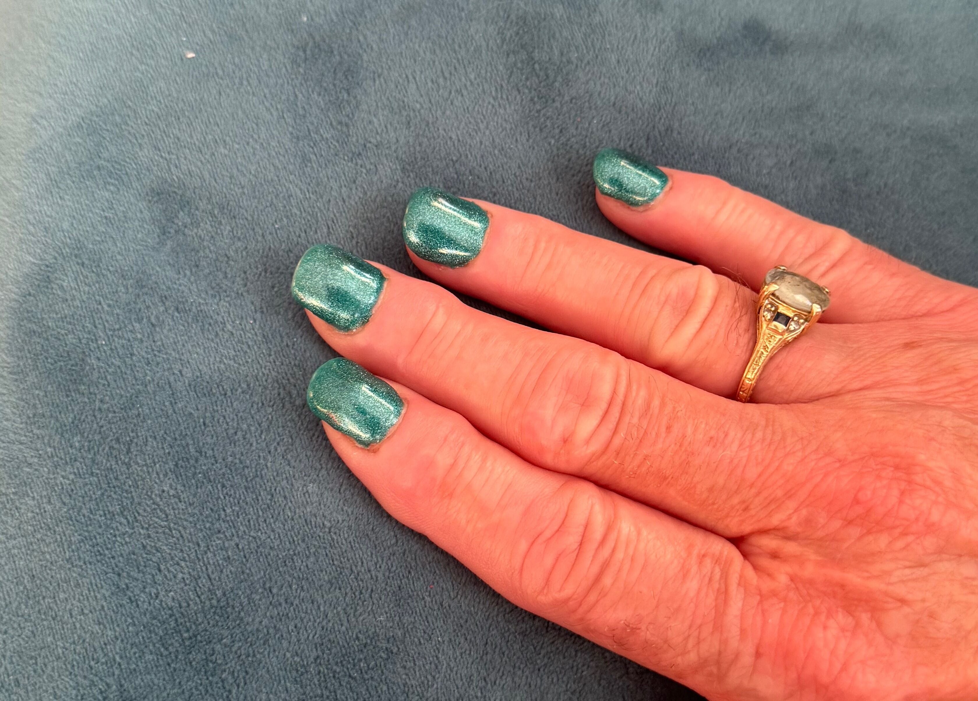 Elegant emerald nails on display at Creative Look on Ruwis 83 Sherbrook Street, Winnipeg, Manitoba, CA.