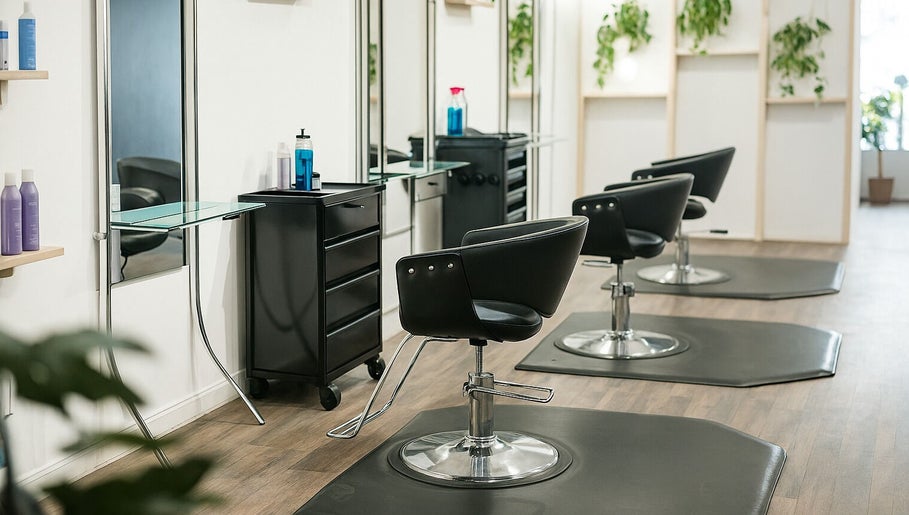 Chic styling chairs at Salon X, Taos, New Mexico, US, featuring modern design and lush greenery.