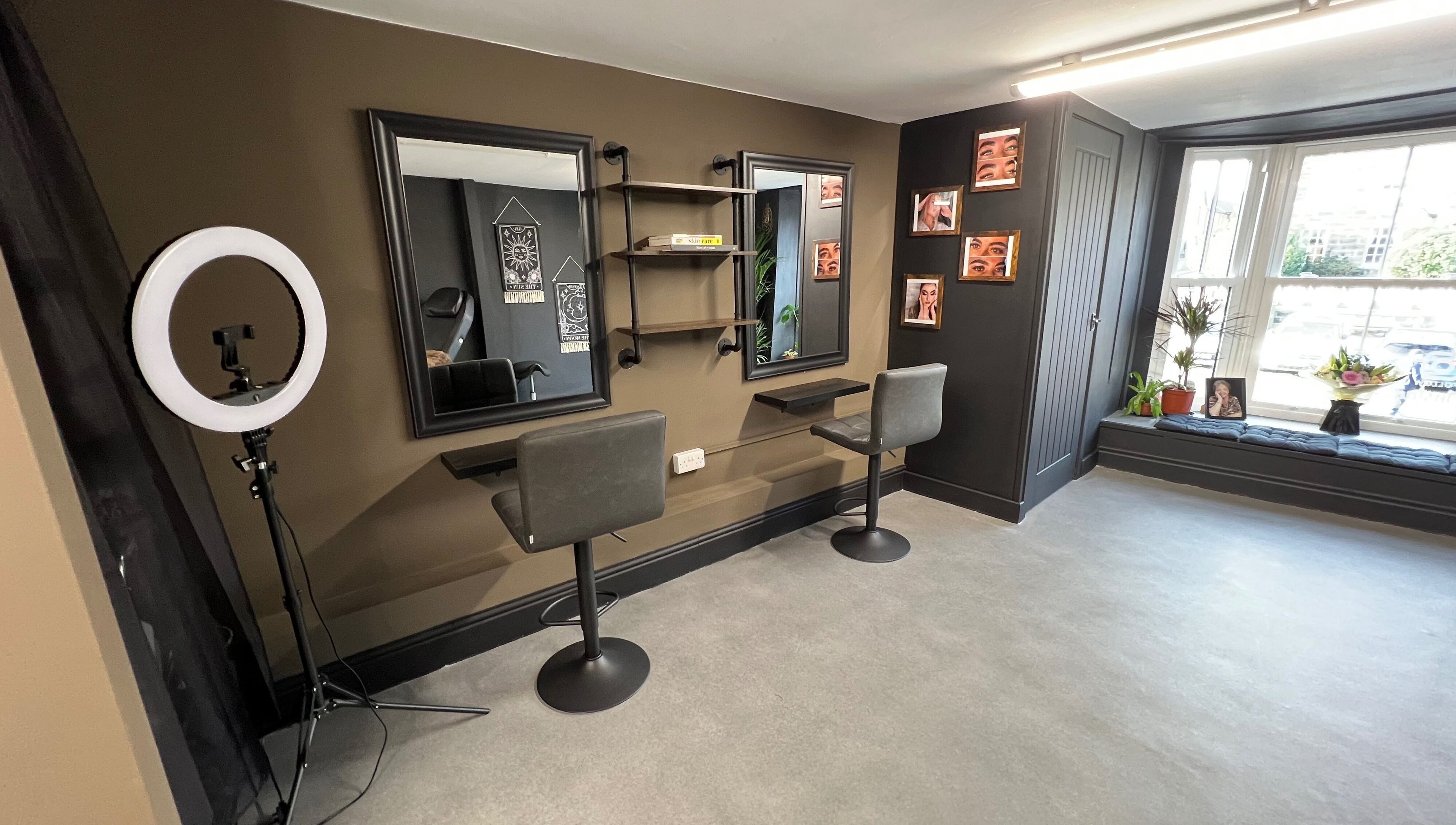 Stylish interior of Tiny Face / Steph, Guisborough, England, GB with two salon chairs and mirrors.